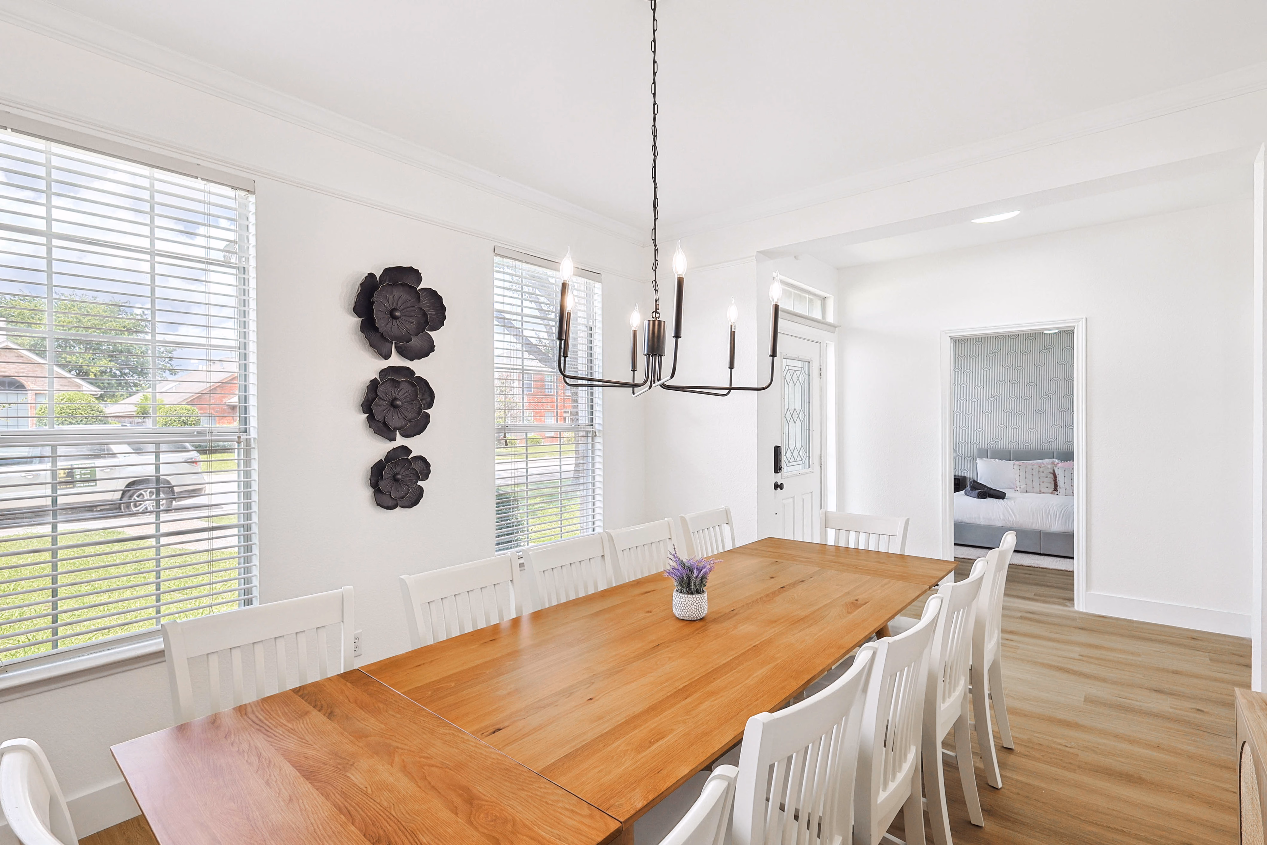Kitchen — center island, granite counters, gas range, stainless appliances and side door to backyard.
